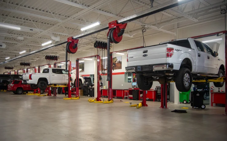 trucks on lifts being serviced