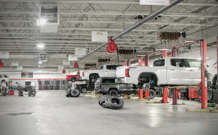 trucks on lifts being serviced