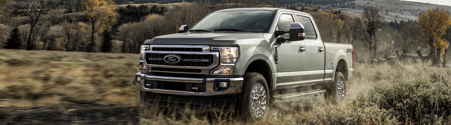 2020 Ford F-250 driving through an open field