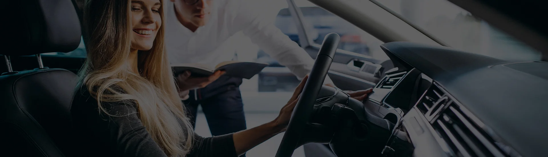 Sales person showing a customer a new Mercedes-Benz