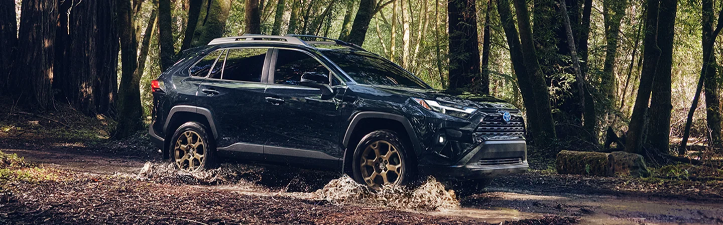 2025 Hyundai Tucson side view blue in woods