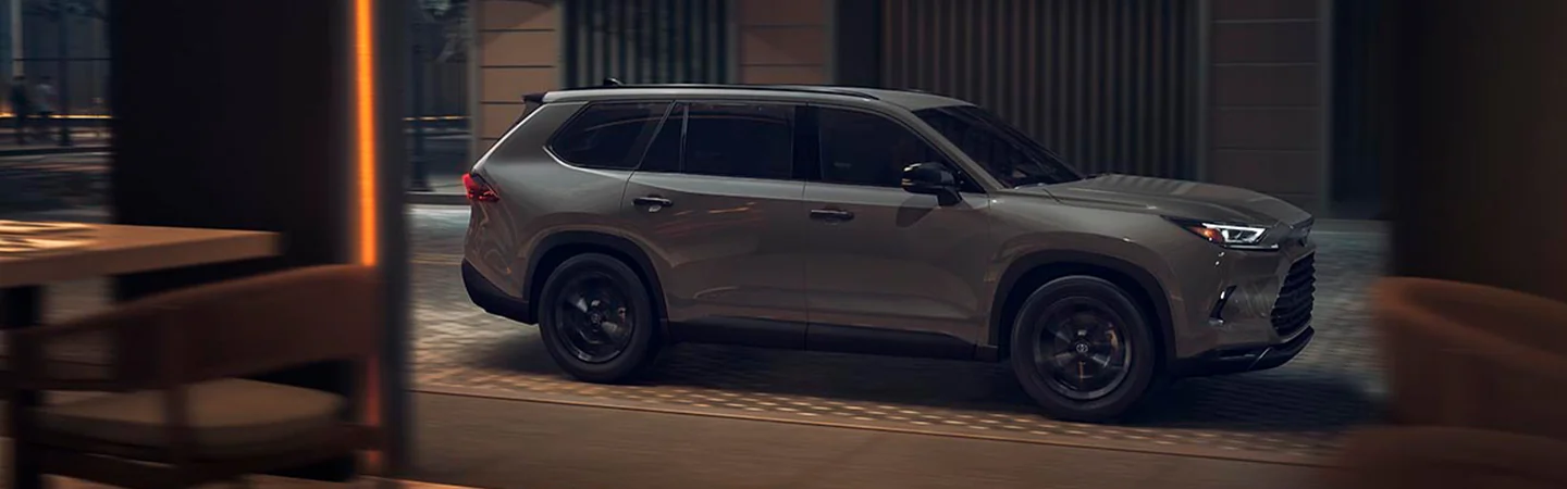 2025 Toyota Grand Highlander Sliver color car on city road