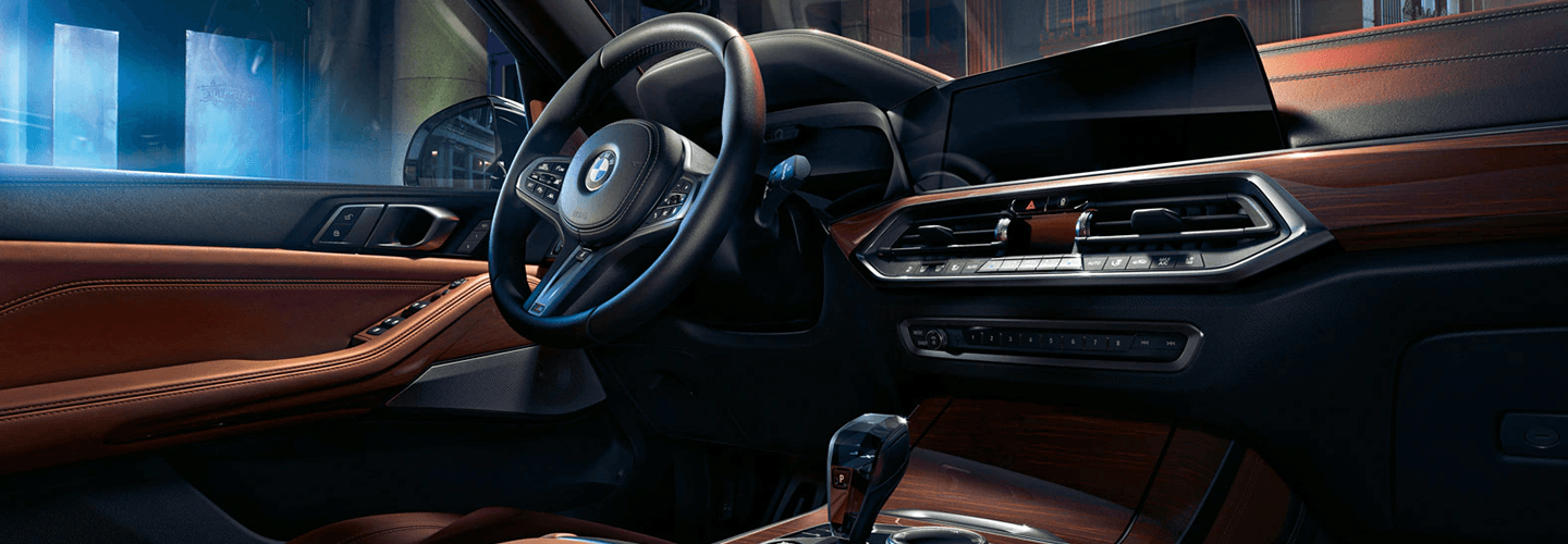 Interior view of a 2021 BMW X3 driver seat and dashboard