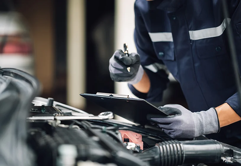 Service tech making notes on the service they are preforming