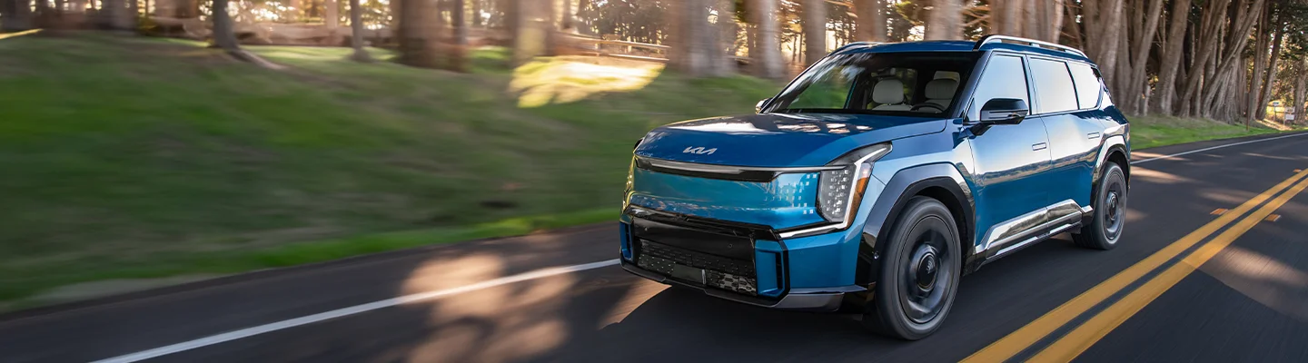 new Blue Kia on the road