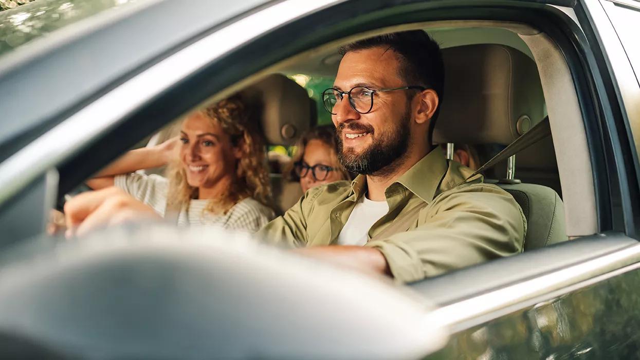 Family driving in their new Subaru