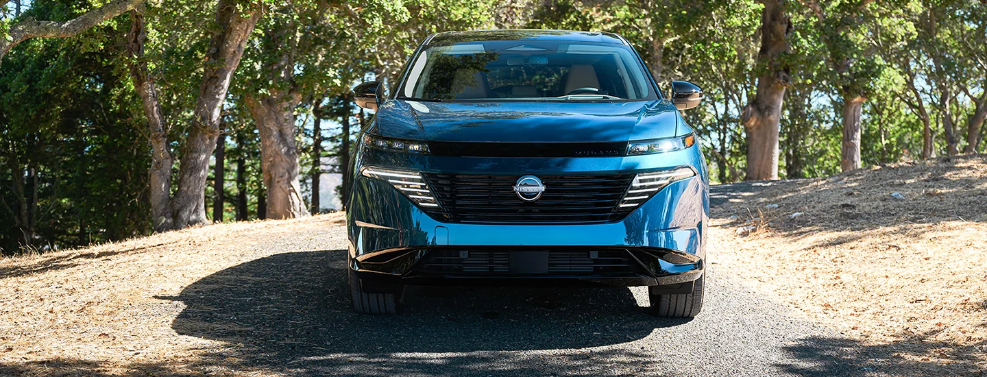 The 2025 Nissan Murano blue color car park on a narrow road