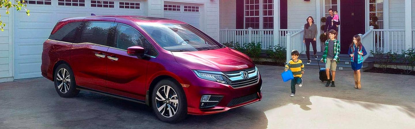 2020 Honda Odyssey in front of a house.