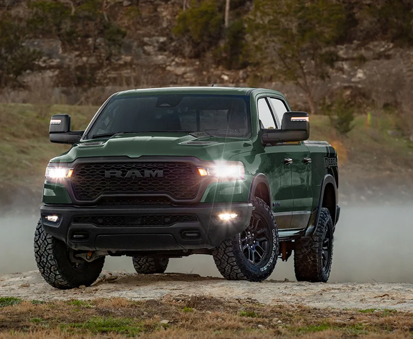 Front view of a parked green 2026 RAM 1500 RHO