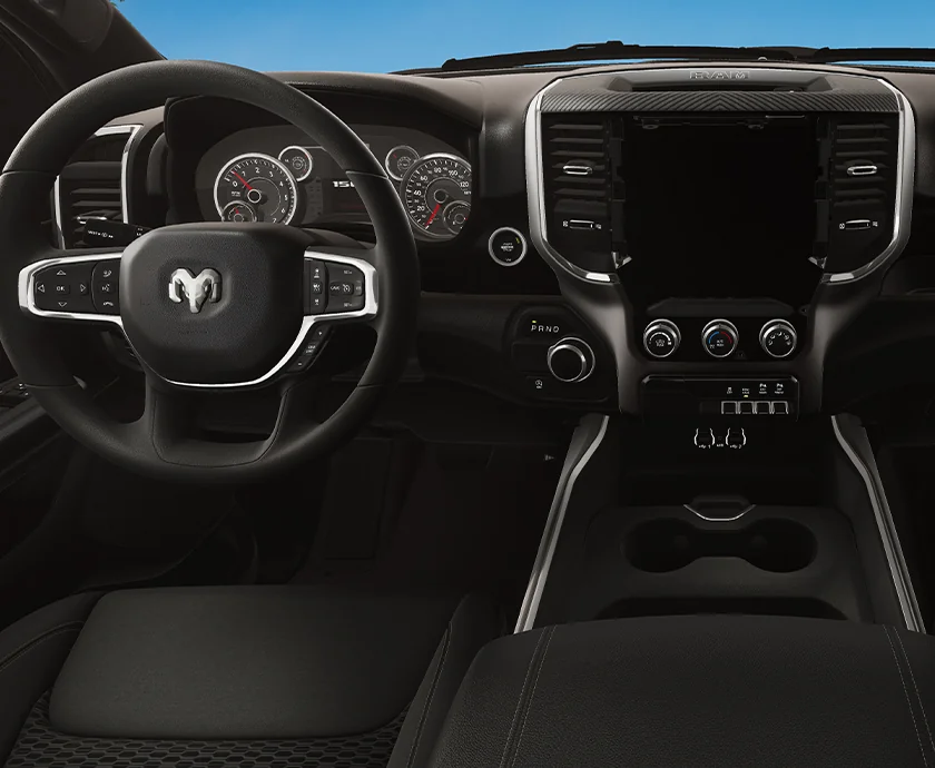 Interior view of the dashboard and tech in a 2026 RAM 1500 RHO