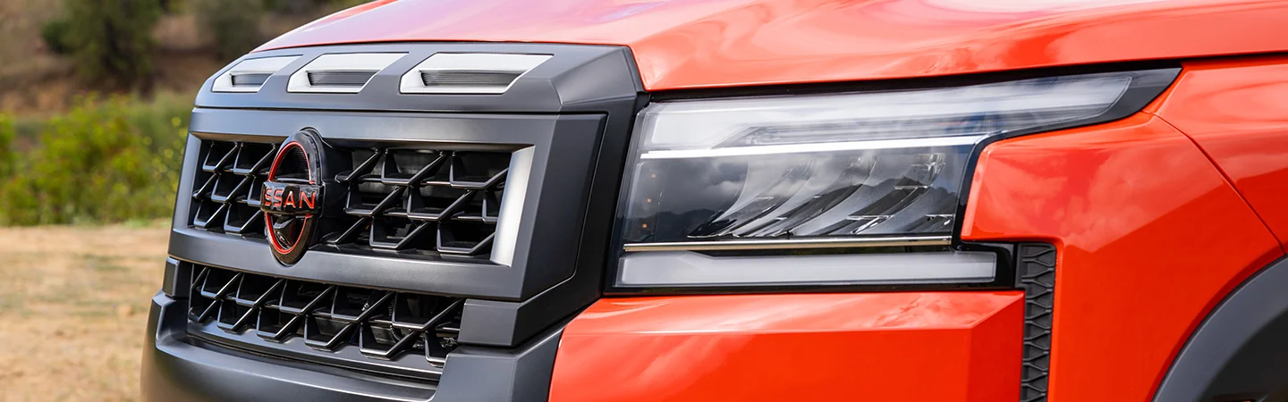 2025 Nissan Frontier Specs Orange Color Front Headlight View