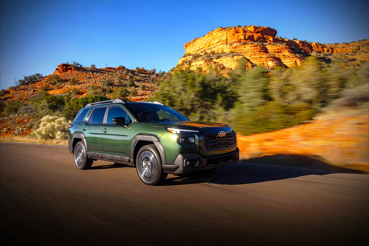 new Subaru Outback on sunset road