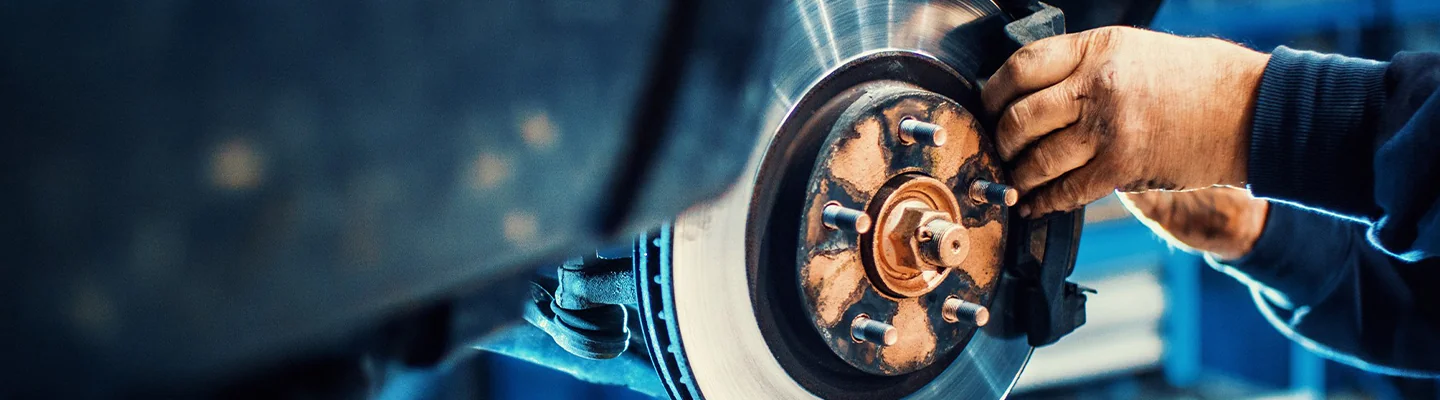 Alfa Romeo service tech doing brake Maintenance