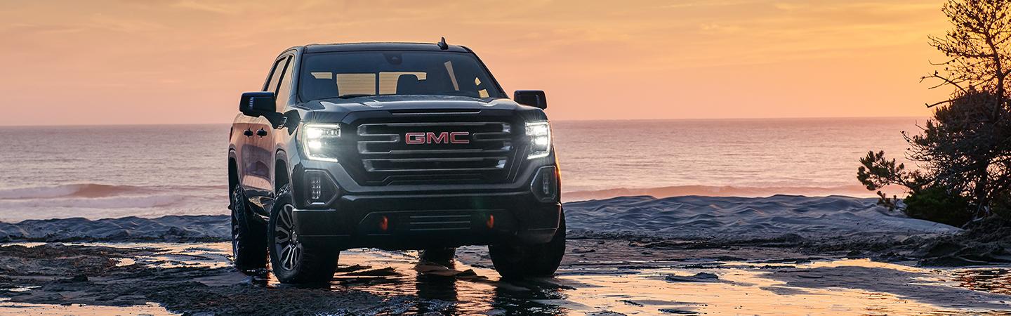 2022 GMC Sierra 1500 parked by the ocean off road