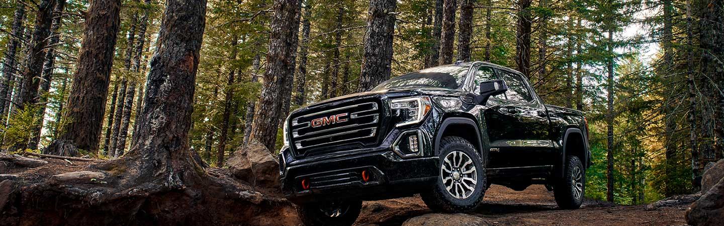 2022 GMC Sierra 1500 off road in a forest