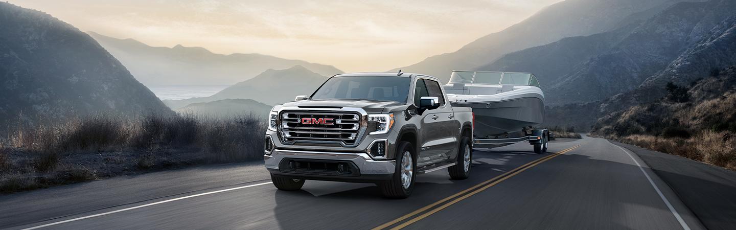 2022 GMC Sierra 1500 towing a boat in mountains