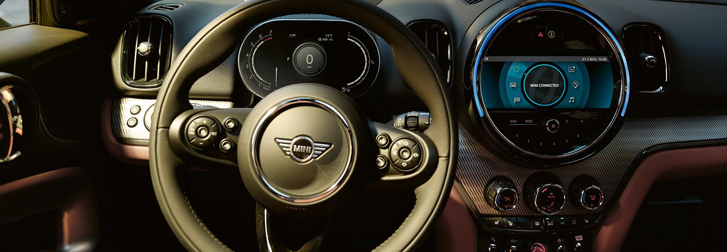 Close up view of a MINI Countryman’s steering wheel and infotainment system