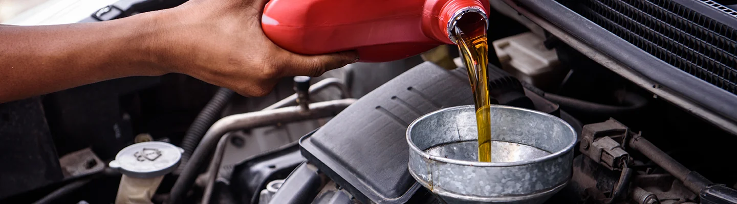 oil being poured into engine