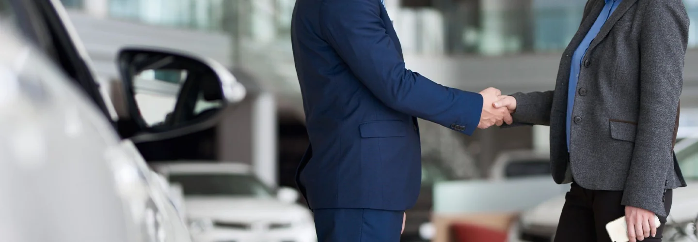 Sales person shaking hand of customer