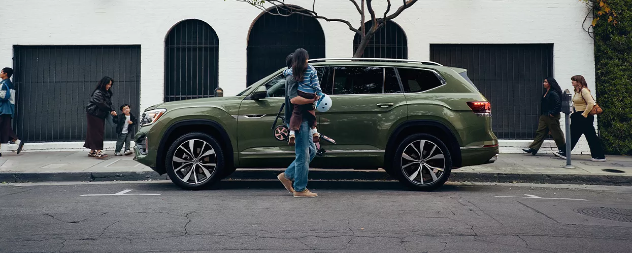 Family getting into their 2026 Volkswagen Atlas