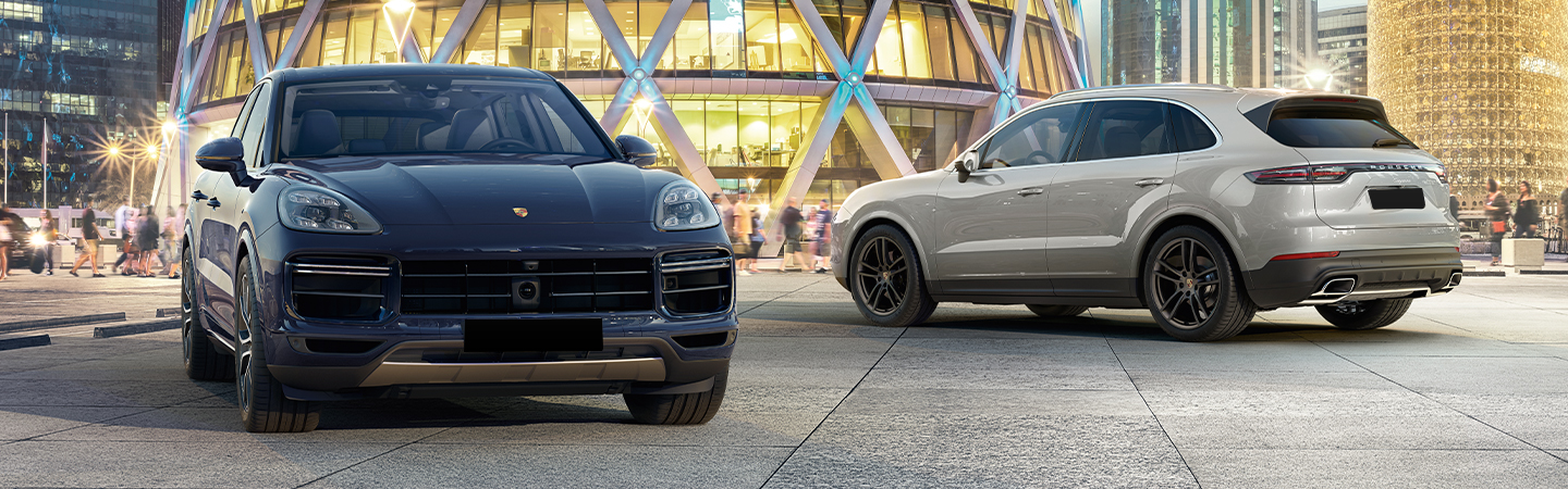 Two 2021 Porsche Cayenne vehicles parked next to each other