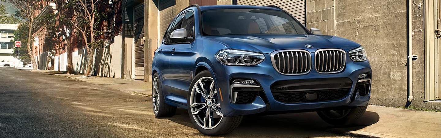 Blue 2021 BMW X3 parked in alley