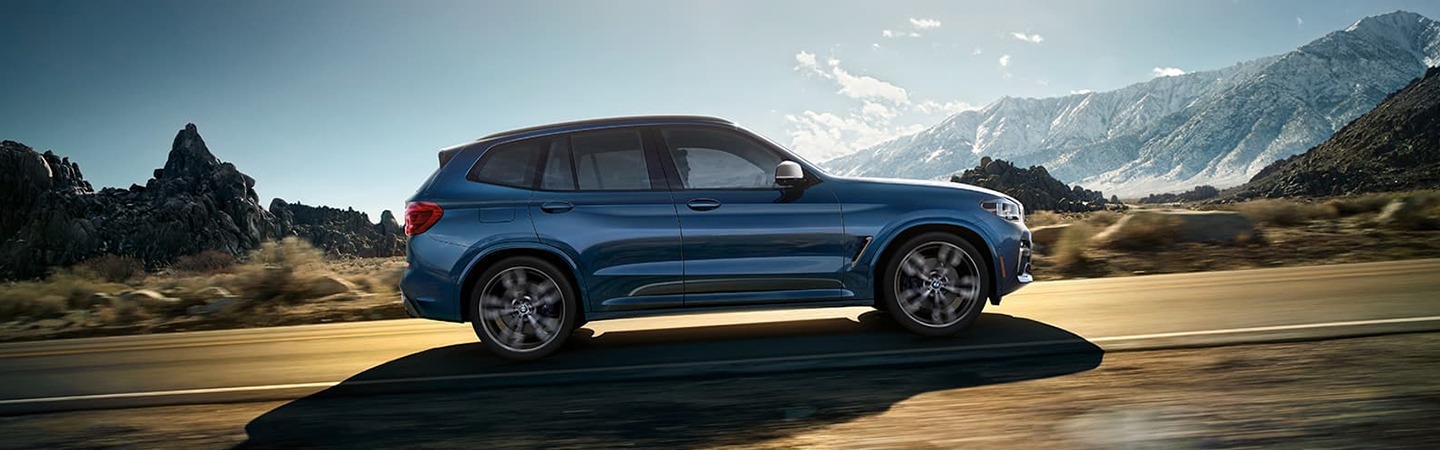 Blue 2021 BMW X3 side view