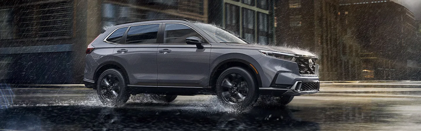 2025 Honda CR-V Hybrid Black color car side view and rainy weather