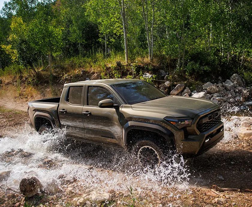 2026 Toyota Tacoma traversing a watery road