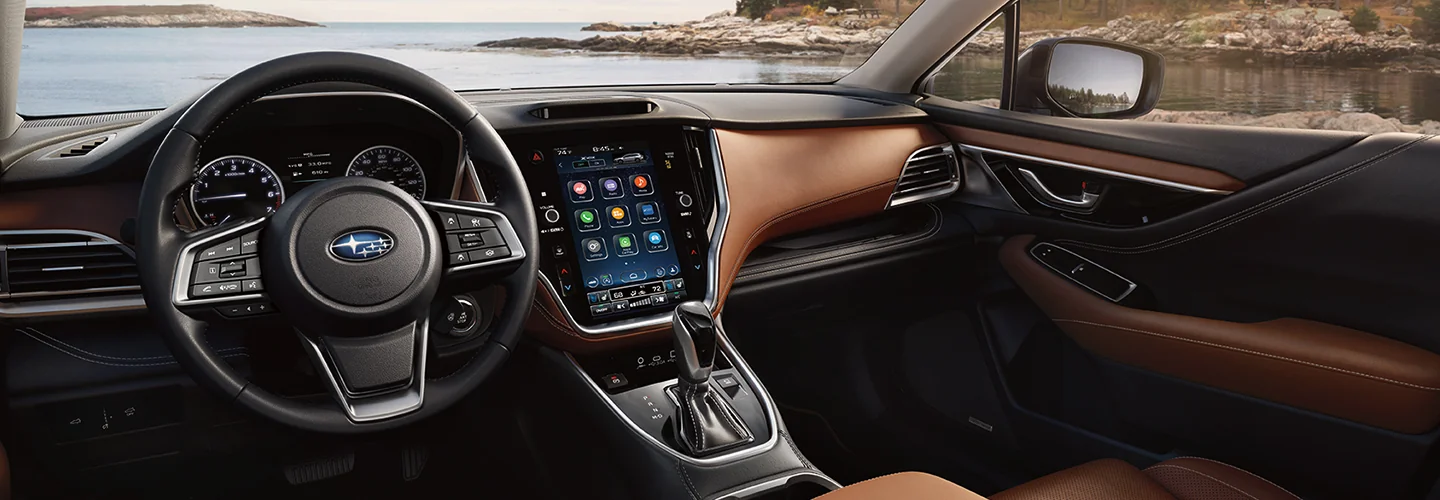 Interior view of the dashboard and tech of a 2025 Subaru Outback in Nederland, TX