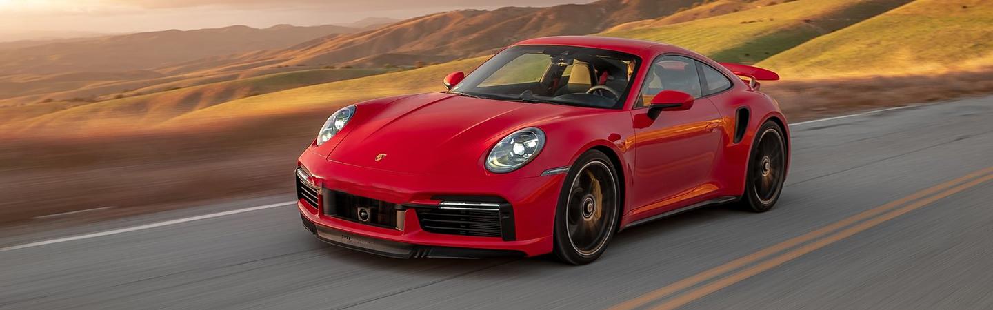 A red Porsche 911 in motion