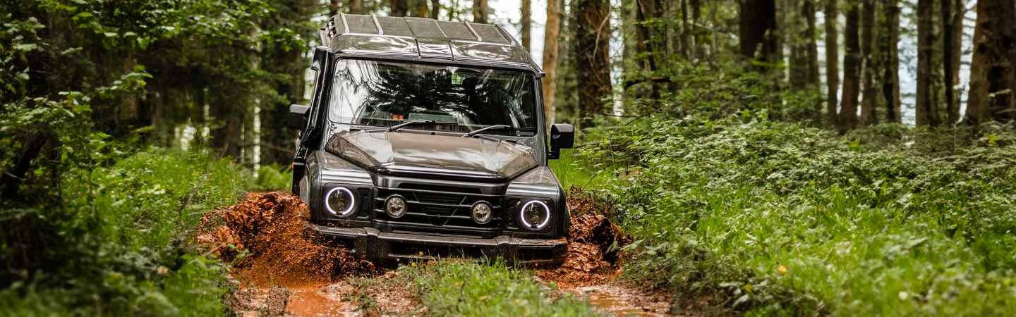 INEOS Grenadier vs Jeep Wrangler black-color frontview