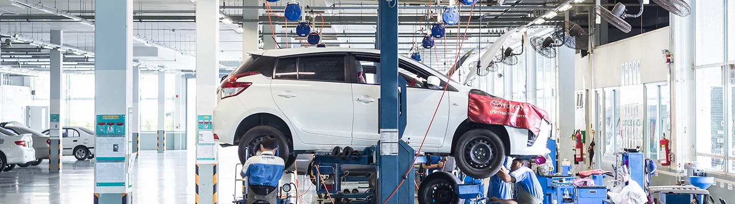 view of car on lift in service bay