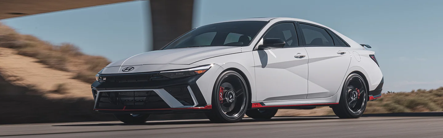 2025 Hyundai Elantra vs Toyota Corolla white color stand on road side view