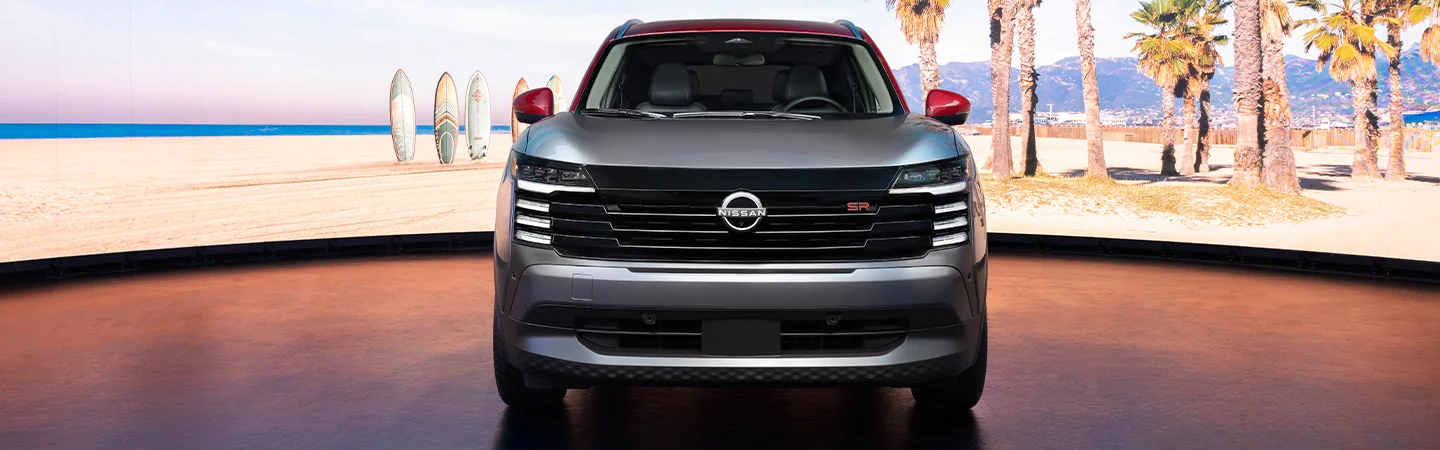 Front view of a parked 2025 Nissan Kicks at the beach