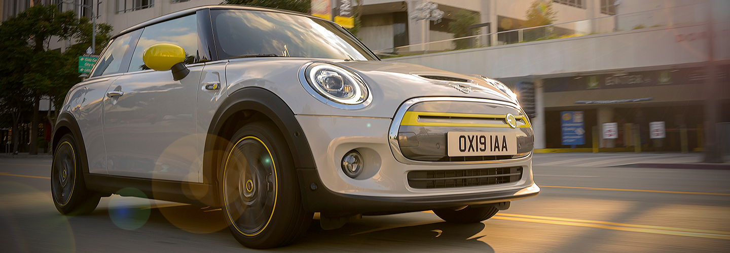 Angled profile of a silver MINI vehicle in motion