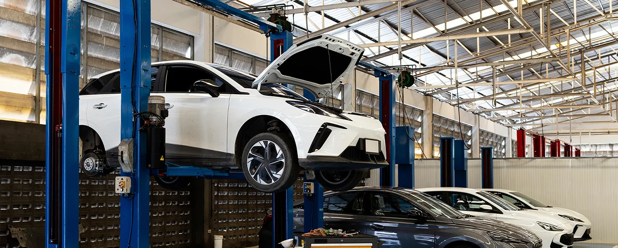 a Hyundai up on a lift in service bay