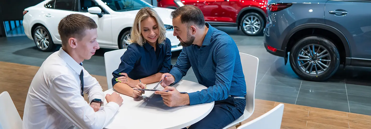 people shopping for a new car at our dealership showroom