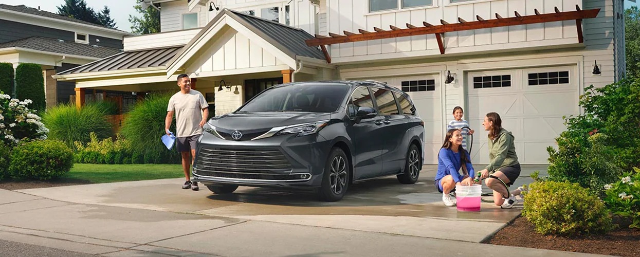 A family washing there 2026 Toyota Sienna in there driveway