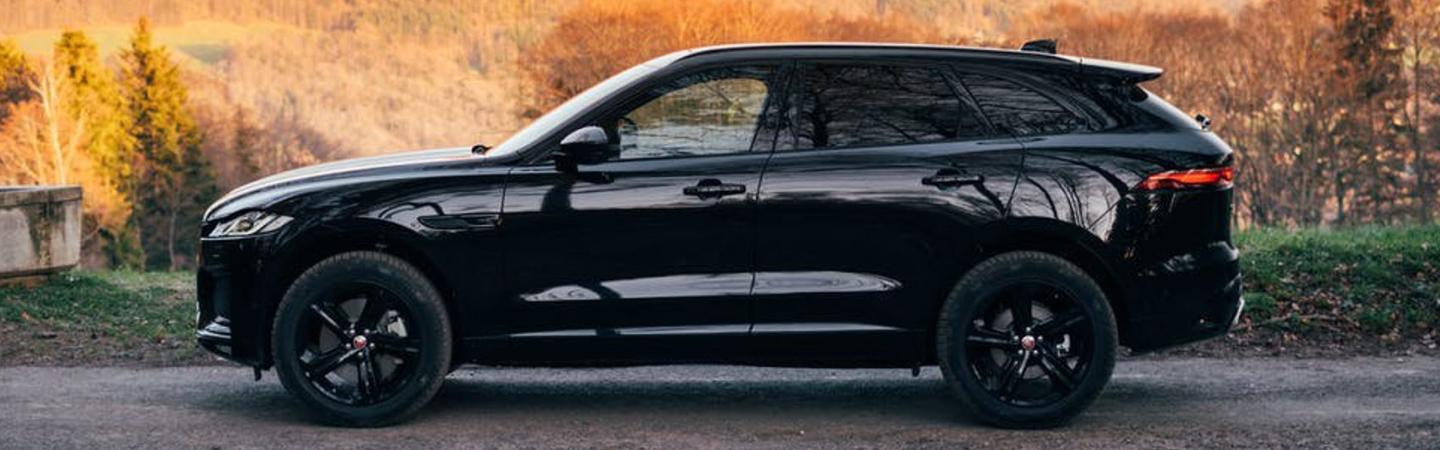 Side view black 2021 Jaguar F-Pace parked