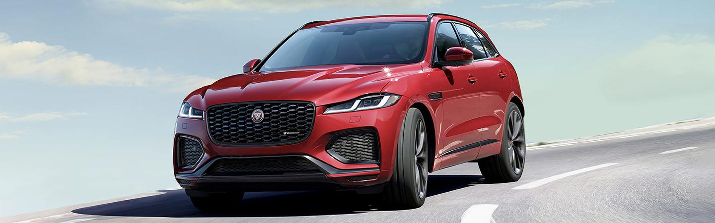 Red 2021 Jaguar F-Pace in motion