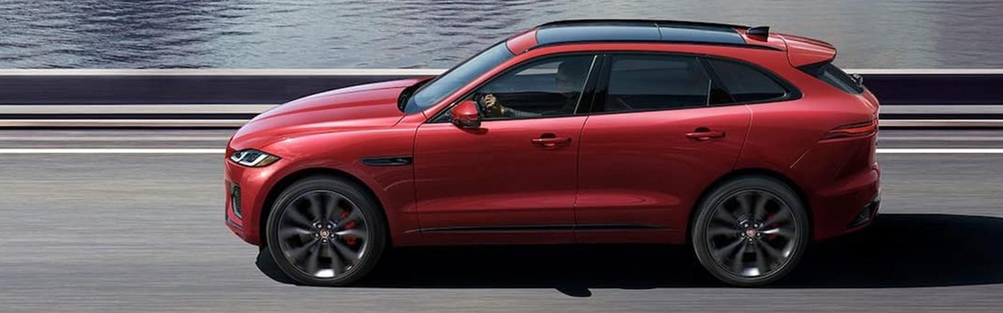 Side view red 2021 Jaguar F-Pace in motion