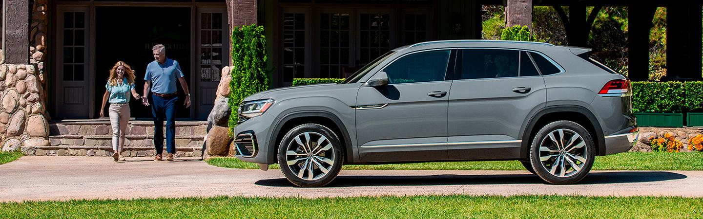 Driver’s side profile of gray VW parked