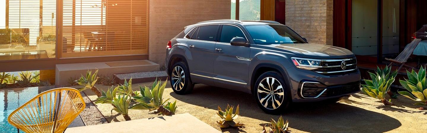 Gray VW parked outside of house