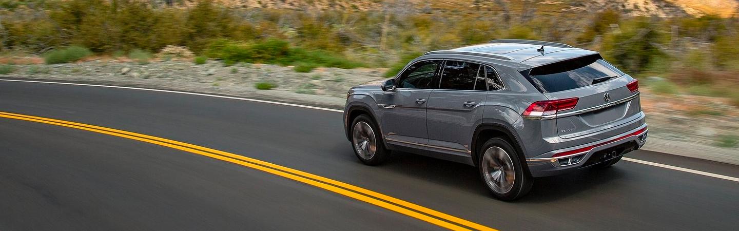 Silver VW rounding a bend