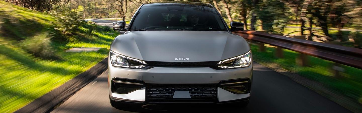 A front view of a gray 2022 Kia EV6 driving