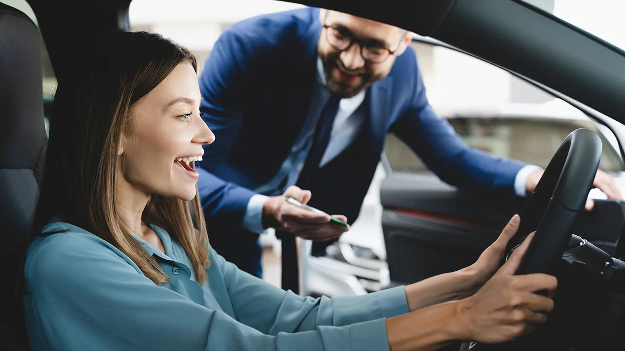 woman sitting in new car