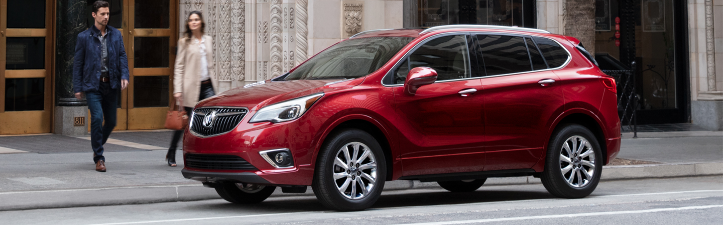 Red 2020 Buick Envision parked on a city street