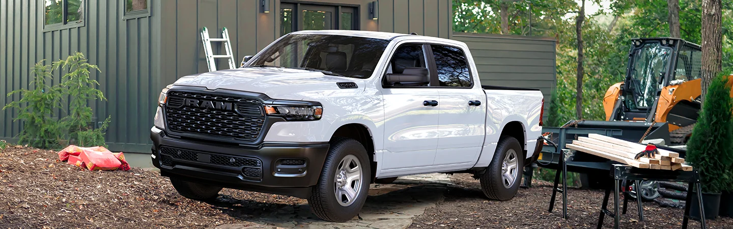 white 2025 RAM 1500 in backyard