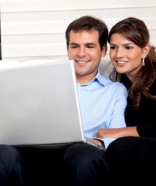 couple viewing laptop